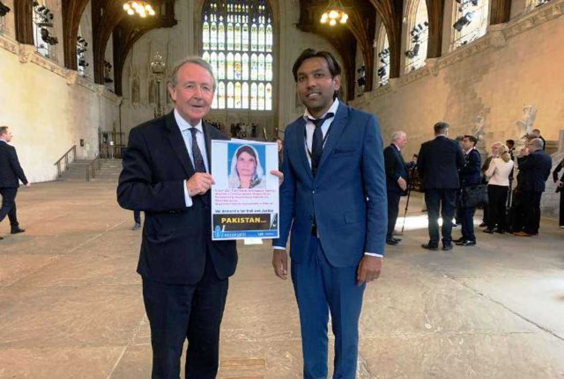 Voice of Justice chairman Joseph Jansen (right) with British parliamentarian David Alton holding a photograph of Pakistani blasphemy victim Shagufta Kiran at the International Ministerial Conference 2022 in London recently