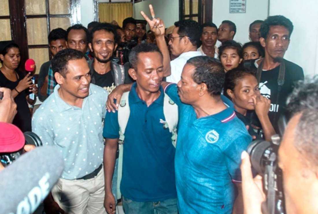 Journalist Raimundos Oki (center) reacts after his court hearing in Dili, East Timor, on June 1, 2017