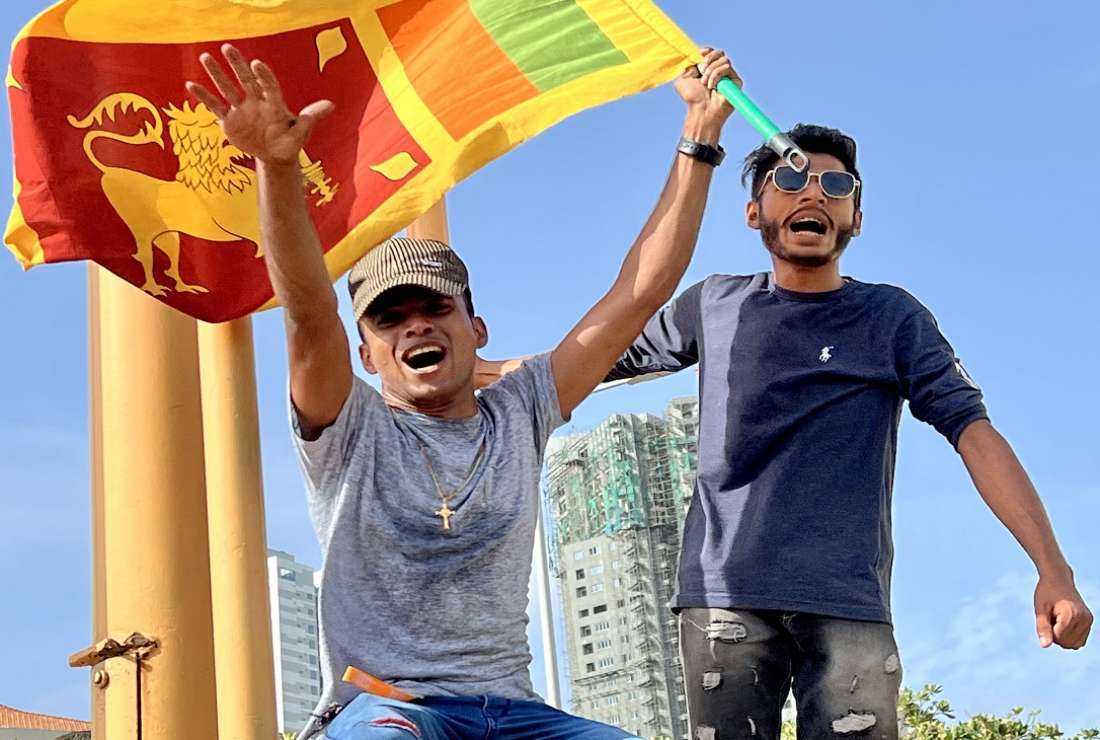 Protesters take to the streets of Colombo after a state of emergency was declared and a curfew imposed