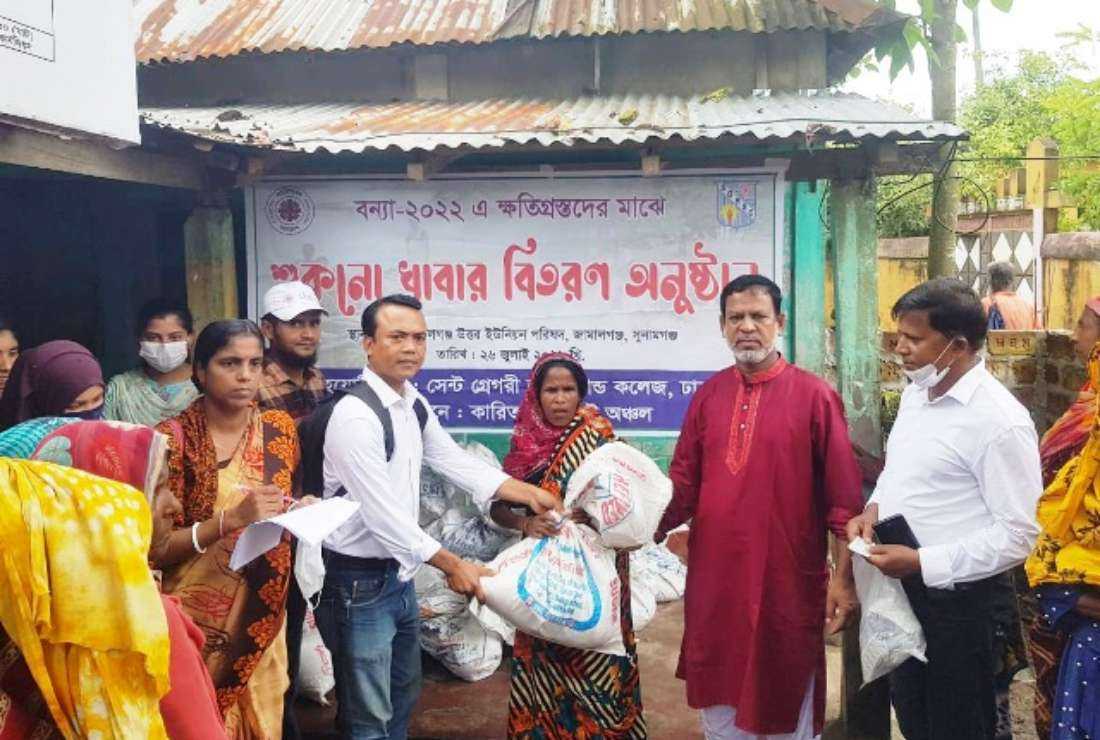 Caritas Bangladesh distributes food and hygiene kits to flood-affected people in Sunamgonj district on July 26.