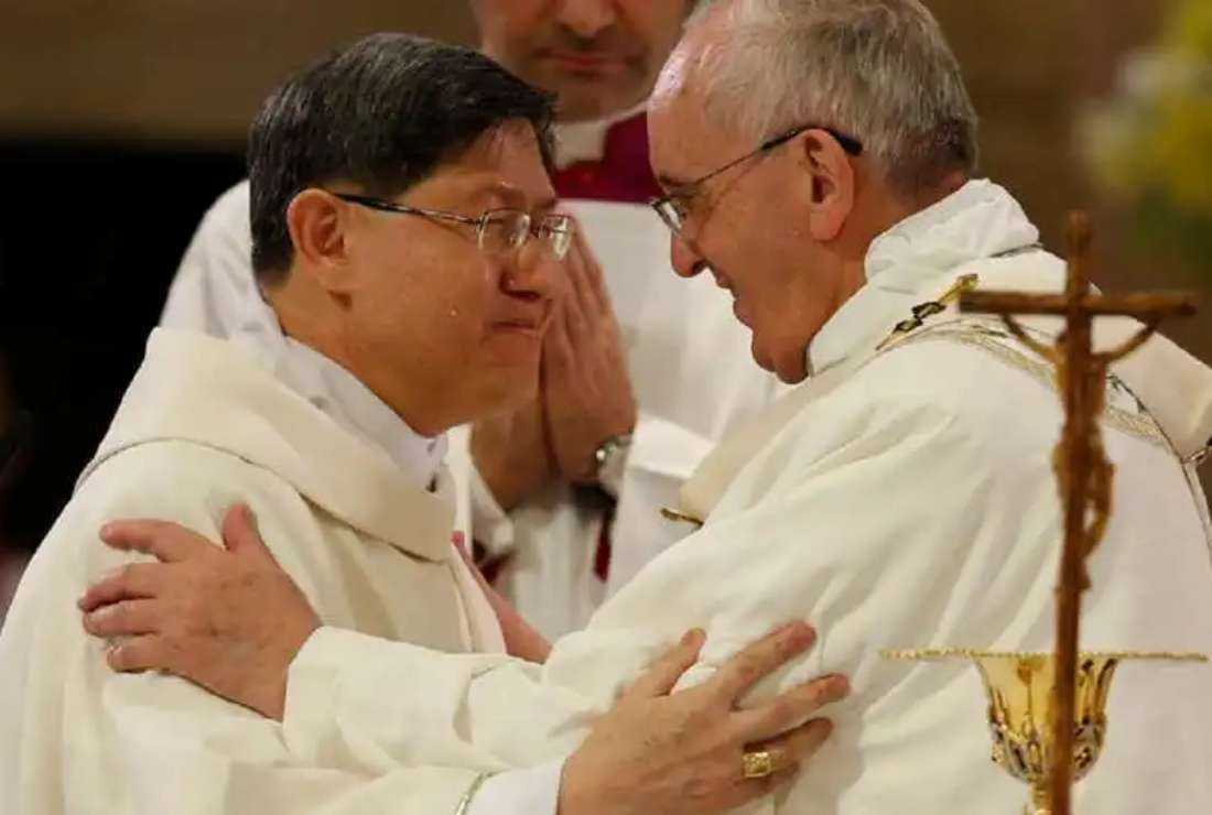 Pope Francis and Cardinal Luis Tagle greet each other at a Mass in Manila in this 2015 file photo