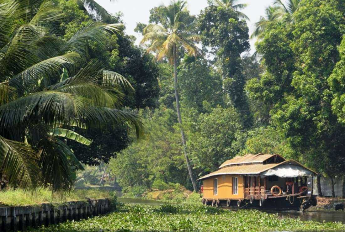 A houseboat sailing in the backwaters, near the city of Alappuzha in the Indian state of Kerala, in this photograph taken on Jan. 9, 2018. The Supreme Court of India has ordered a ban on human activities in buffer zones around protected forests, parks and sanctuaries, which may displace a million people in the southern state
