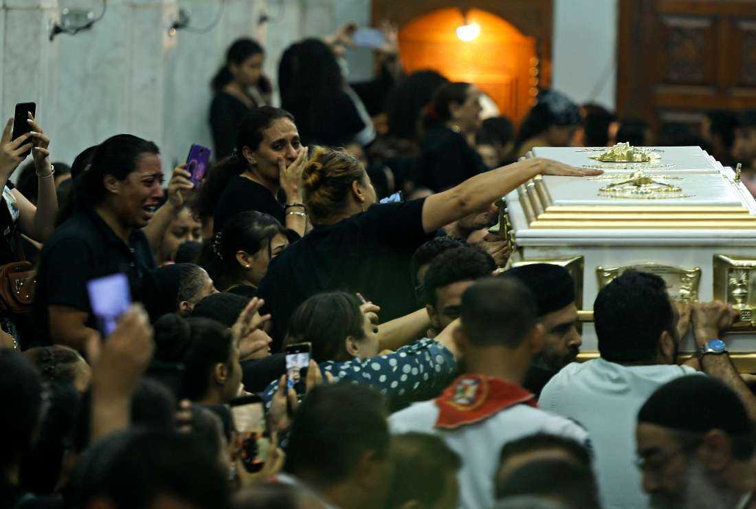 Egyptian mourners attend the funeral of victims killed in Cairo Coptic church fire, at the church of the Blessed Virgin Mary in the Giza Governorate on Aug. 14