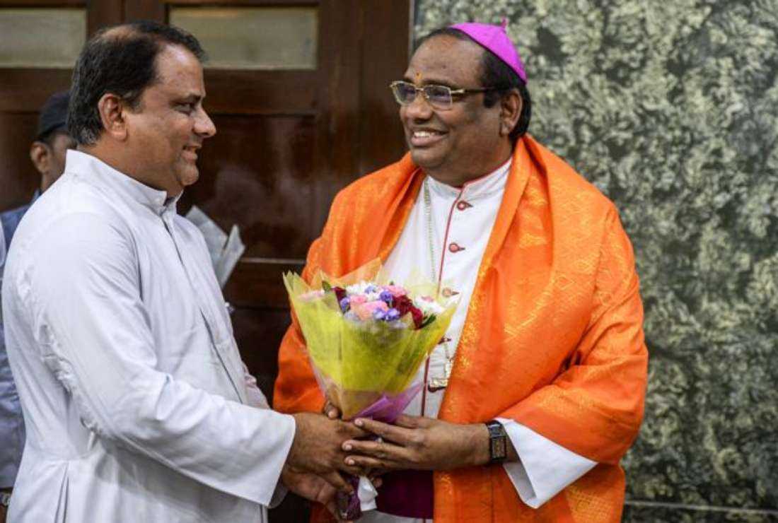Archbishop Anthony Poola (right) of Hyderabad is greeted by Procurator and Chancellor reverend Father Victor Emmanuel after being named as a cardinal by Pope Francis, during a welcome ceremony by the clergy and faithful at the Bishop's House in Hyderabad on May 30