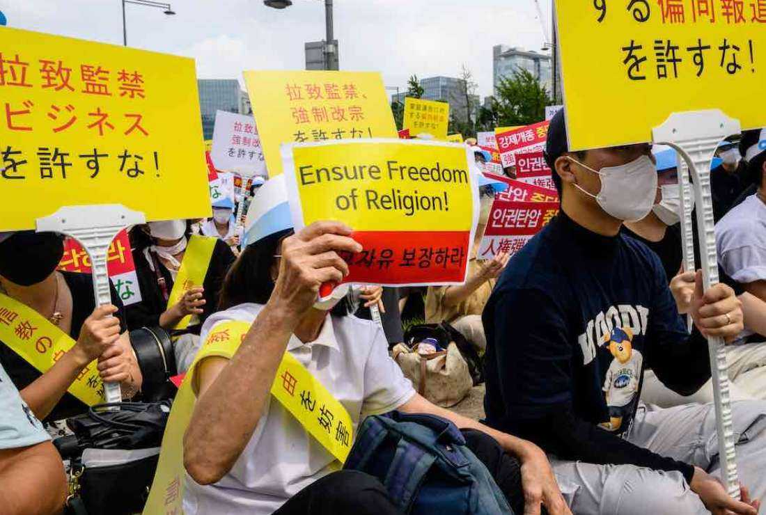 Members of the Unification Church protest in Seoul on Aug 18 against media coverage the group has received in Japan following the assassination in early July of former Japanese prime minister Shinzo Abe. The church was founded by Sun Myung Moon in Korea in 1954 and its followers are colloquially known as Moonies