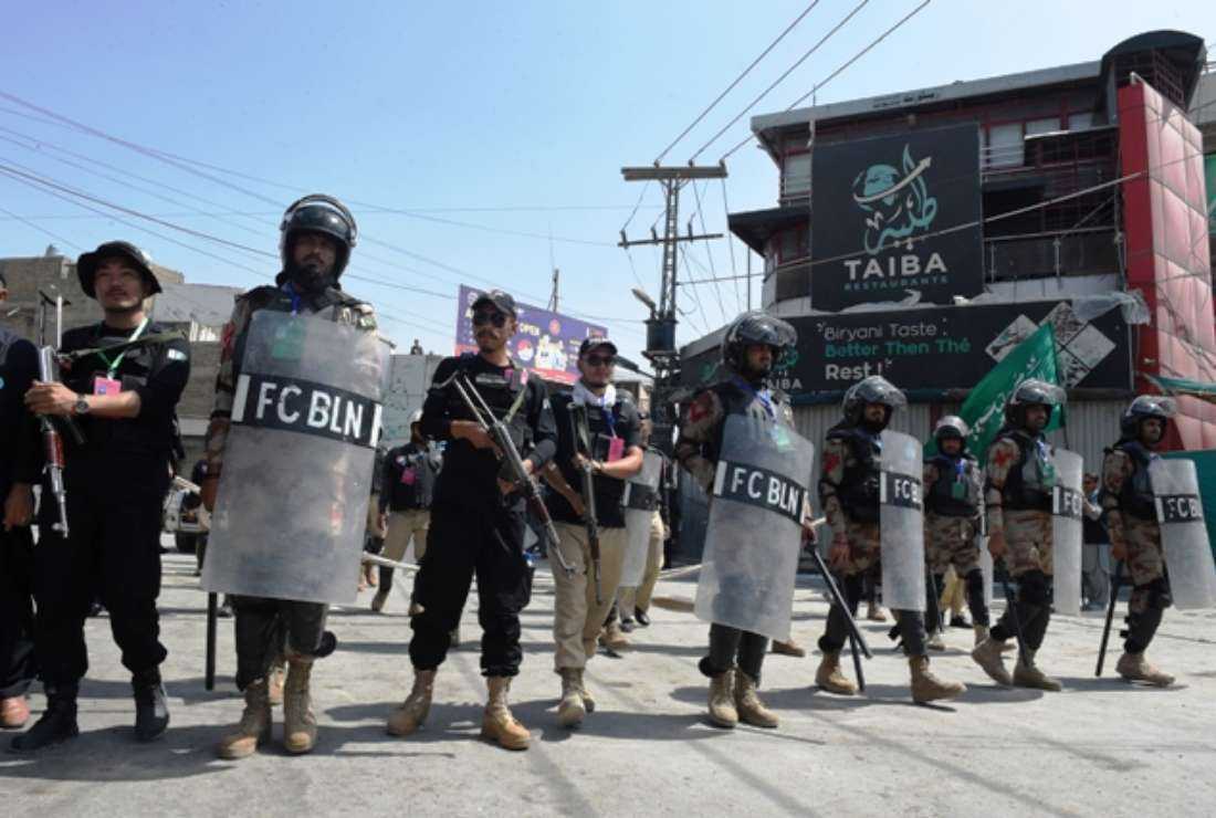 Security personnel patrol a street during the Islamic month of Muharram in Quetta on Aug. 9