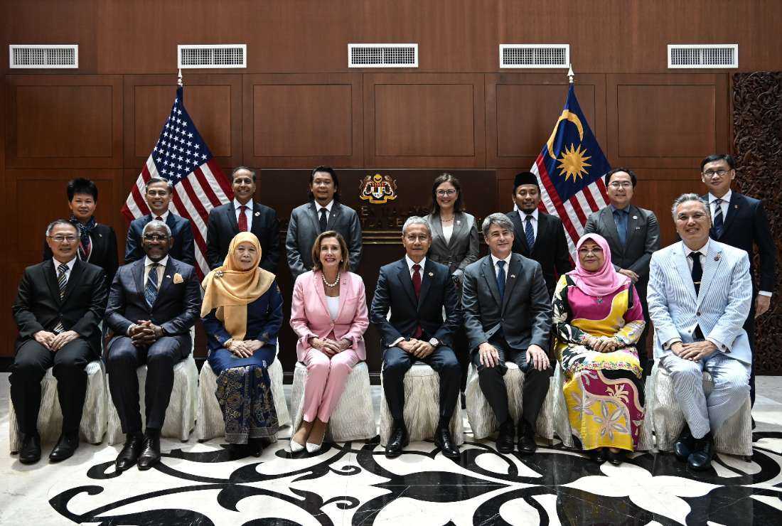 Malaysia's Speaker of the Dewan Rakyat, Azhar Azizan Harun (front row, fourth from right), posing with Speaker of the US House of Representatives Nancy Pelosi (front row, fourth from left) and officials before a meeting at the Parliament House in Kuala Lumpur on Aug. 2.