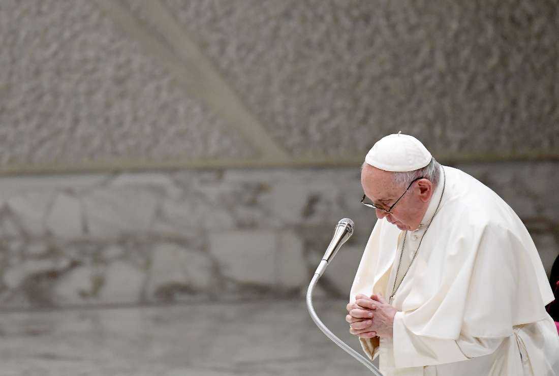 Pope Francis prays during the weekly general audience at Paul-VI hall in The Vatican, on August 24, 2022