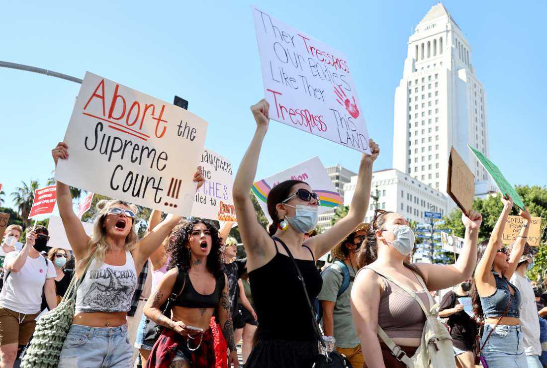 Abortion rights supporters march past City Hall while protesting against the recent US Supreme Court decision to end federal abortion rights protections in Los Angeles, California, on June 27