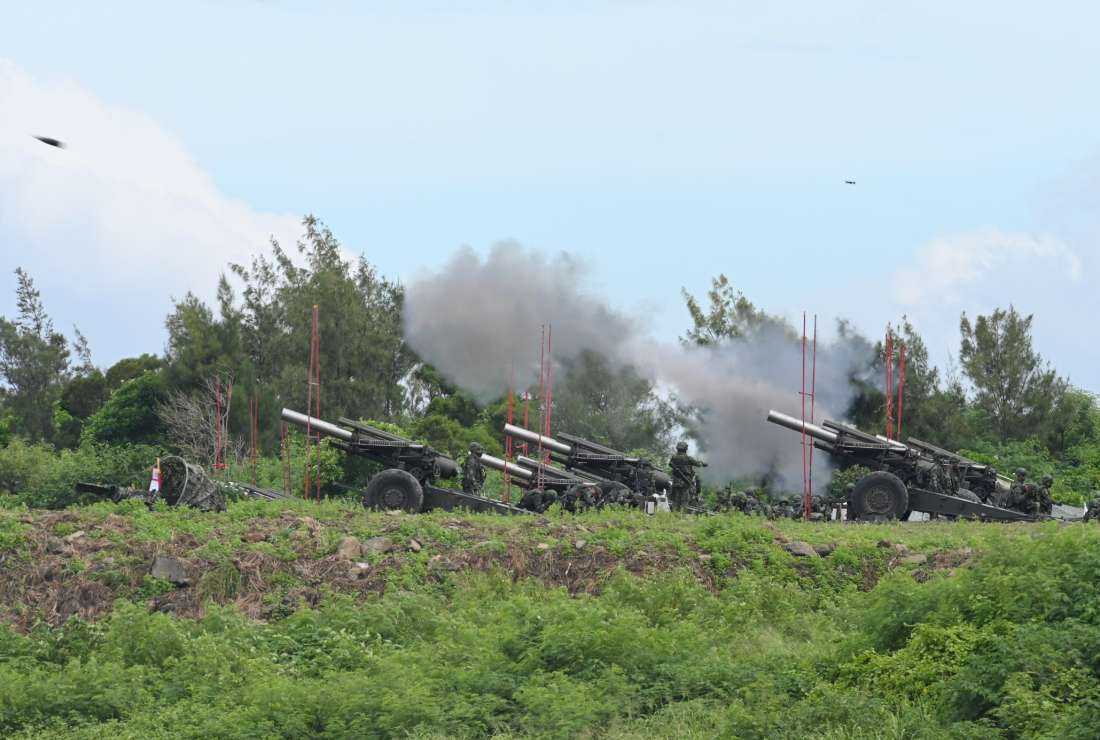 Taiwan military soldiers fire the 155-inch howitzers during a live fire anti-landing drill in Pingtung county, southern Taiwan on Aug. 9.