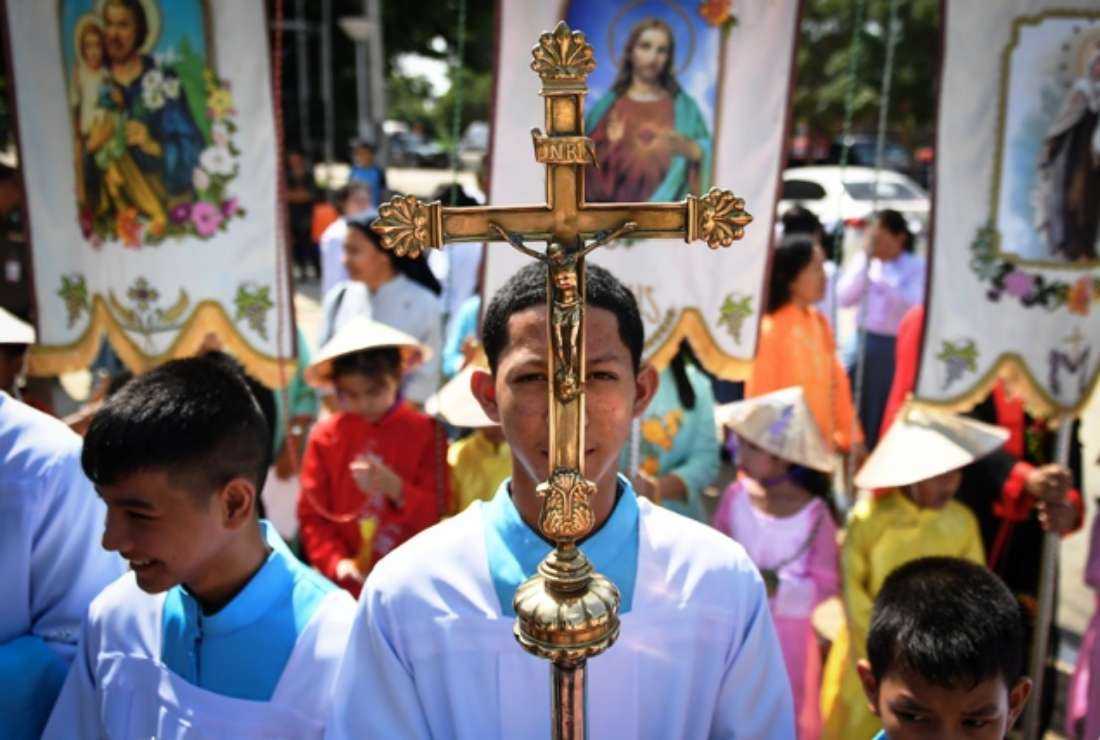 Thai Catholics of Vietnamese descent carrying a cross ahead of Pope Francis' visit to Thailand, outside the Phra Mae Prachak Church in the central Thai province of Suphan Buri on Oct. 26, 2019