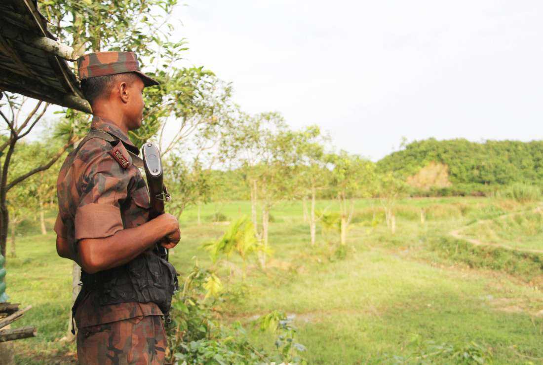 A soldier of the Border Guard Bangladesh (BGB) patrols near the Bangladesh-Myanmar border in this file photo