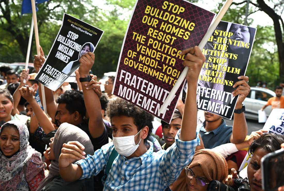 Students hold up placards and shout slogans during a demonstration outside the Uttar Pradesh Bhawan in New Delhi on June 13, 2022, to protest against the state government for demolishing the house of a local Muslim leader in Allahabad