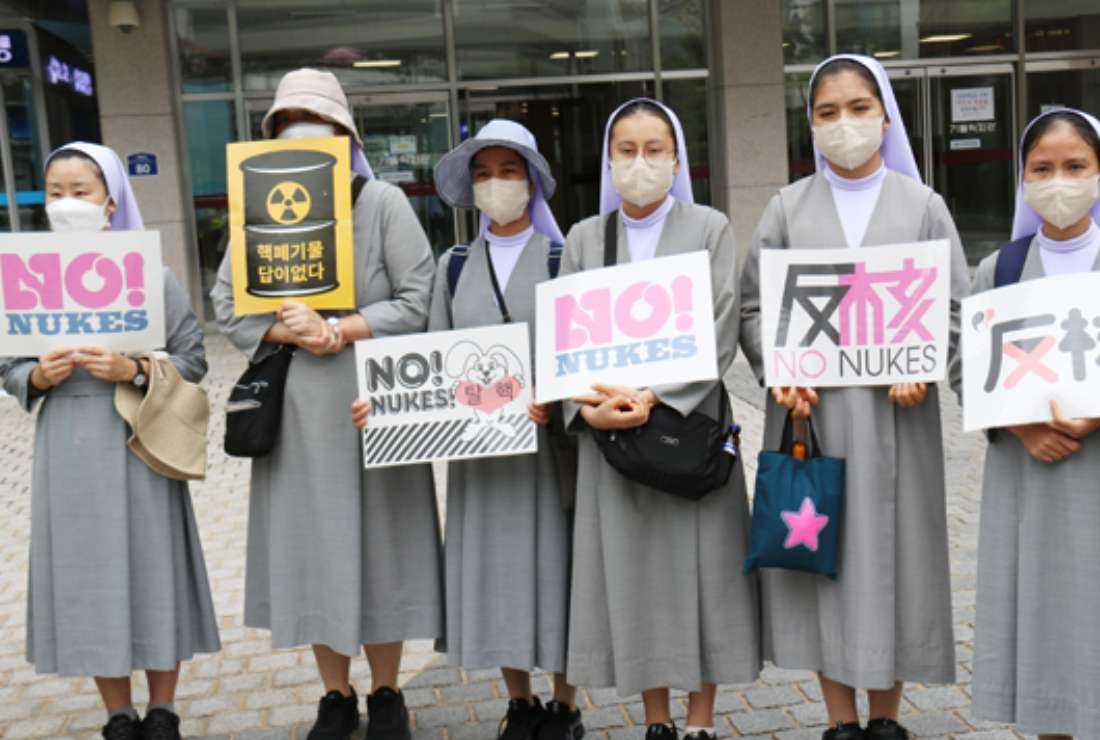 Catholic nuns hold anti-nuclear placards during an Aug. 28-31 pilgrimage for peace in South Korea