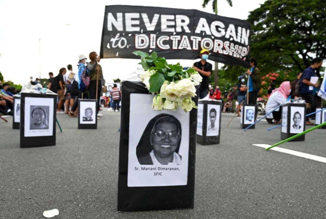 Pictures of human rights defenders and church leaders are laid along a road during a demonstration on the occasion of the 50th Anniversary since the imposition of Martial Law, at the University of the Philippines in Quezon City, suburban Manila, on Sept. 21