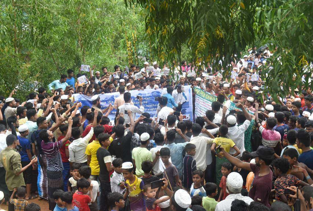 Rohingya refugees walk a Go home campaign rally demanding repatriation at Kutupalong Rohingya camp in Cox's Bazar on June 19