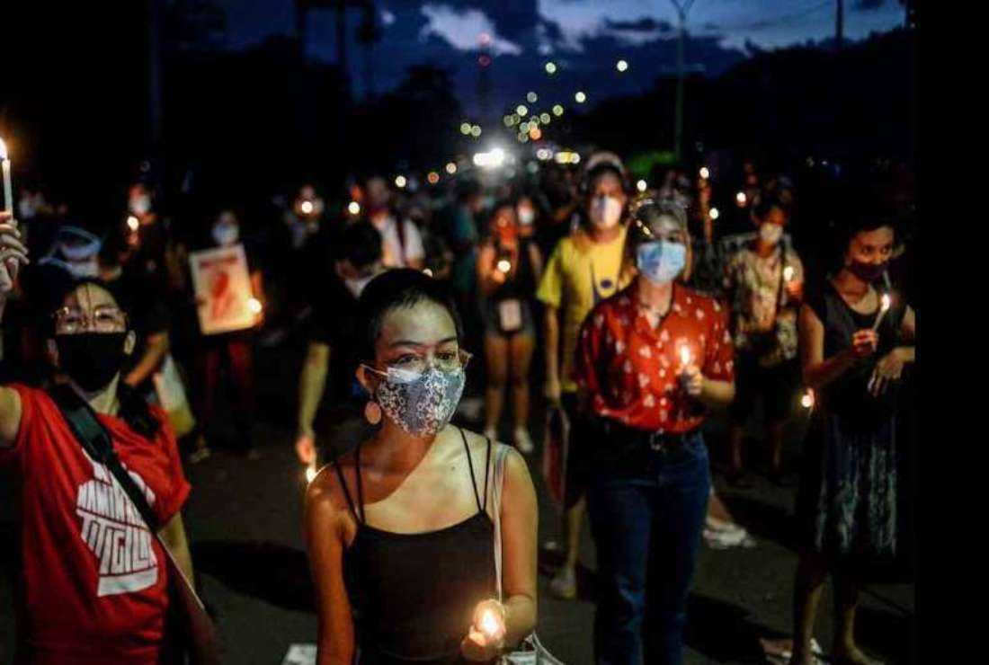 Activists light candles on the 48th anniversary of the martial law declaration in the Philippines, in Quezon City on Sept. 21, 2020
