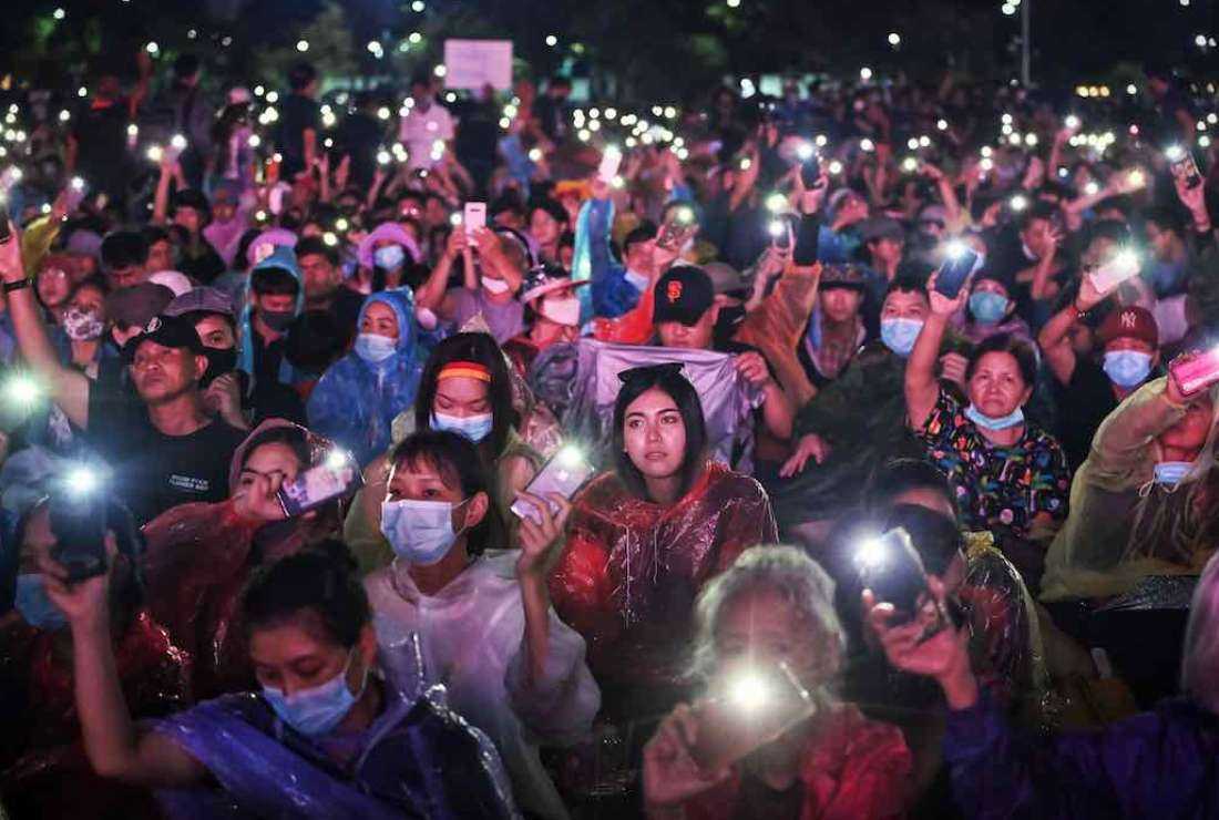 Anti-government protesters hold their mobile phones aloft as they take part in a pro-democracy rally in Bangkok on Sept. 19, 2020