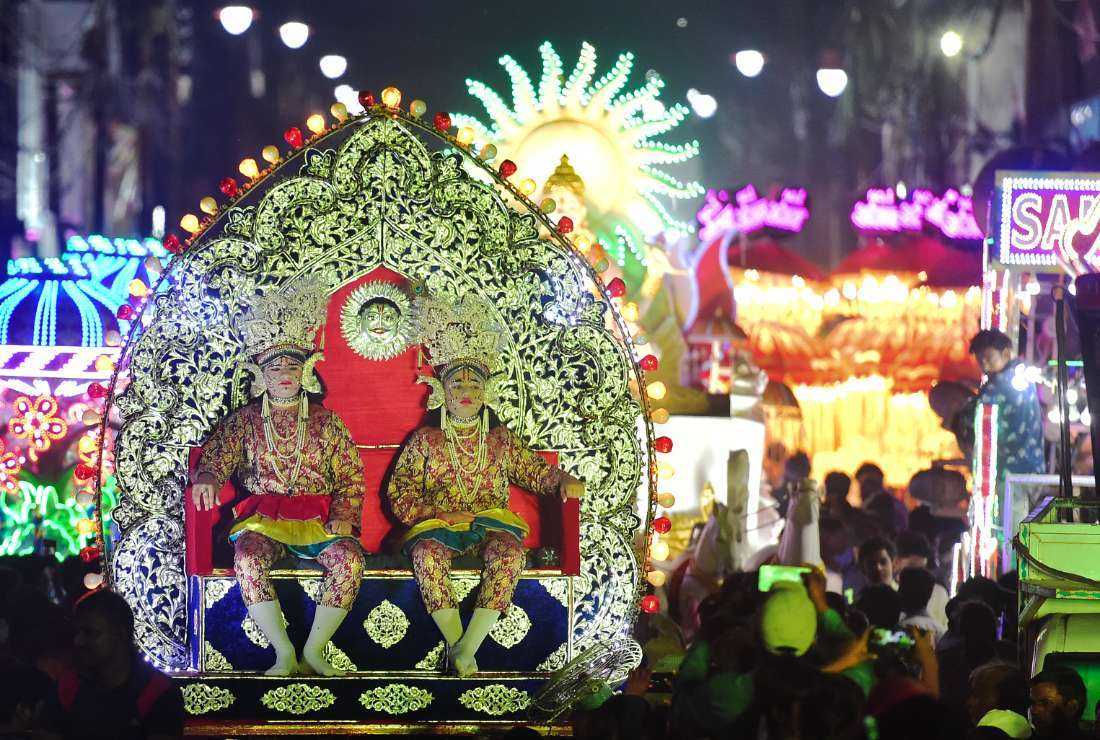 Artists dressed as Hindu gods sit on a tableau in a religious procession during celebrations to mark Dussehra festivities in the northern Indian city of Allahabad on Sept. 25. The country's Supreme Court is hearing a plea seeking stricter action to curb fraudulent religious conversions luring away majority Hindus to other religions
