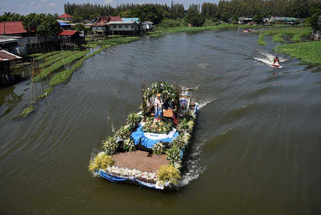 A decorated boat carrying a statue of the Virgin Mary sailing on a river in a procession by Thai Catholics of Vietnamese descent in the central Thai province of Suphan Buri, ahead of Pope Francis' visit to Thailand, on Oct. 26,  2019