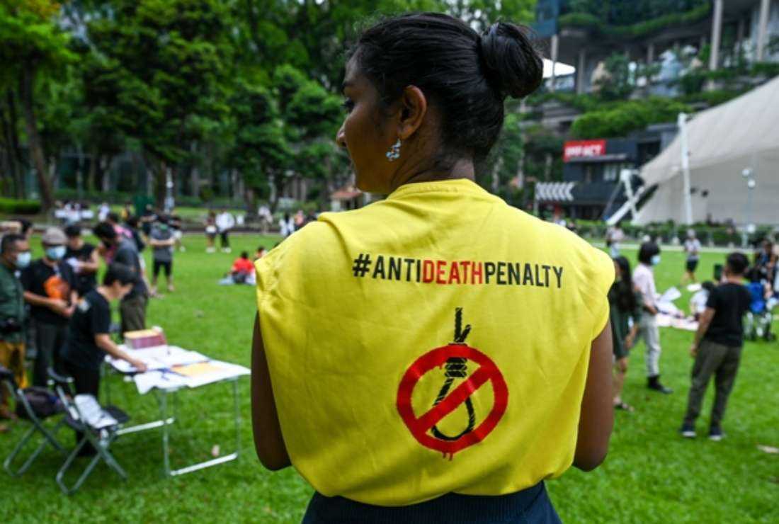 An activist wears a T-shirt with a sign against the death penalty during a protest at Speakers' Corner in Singapore on April 3.