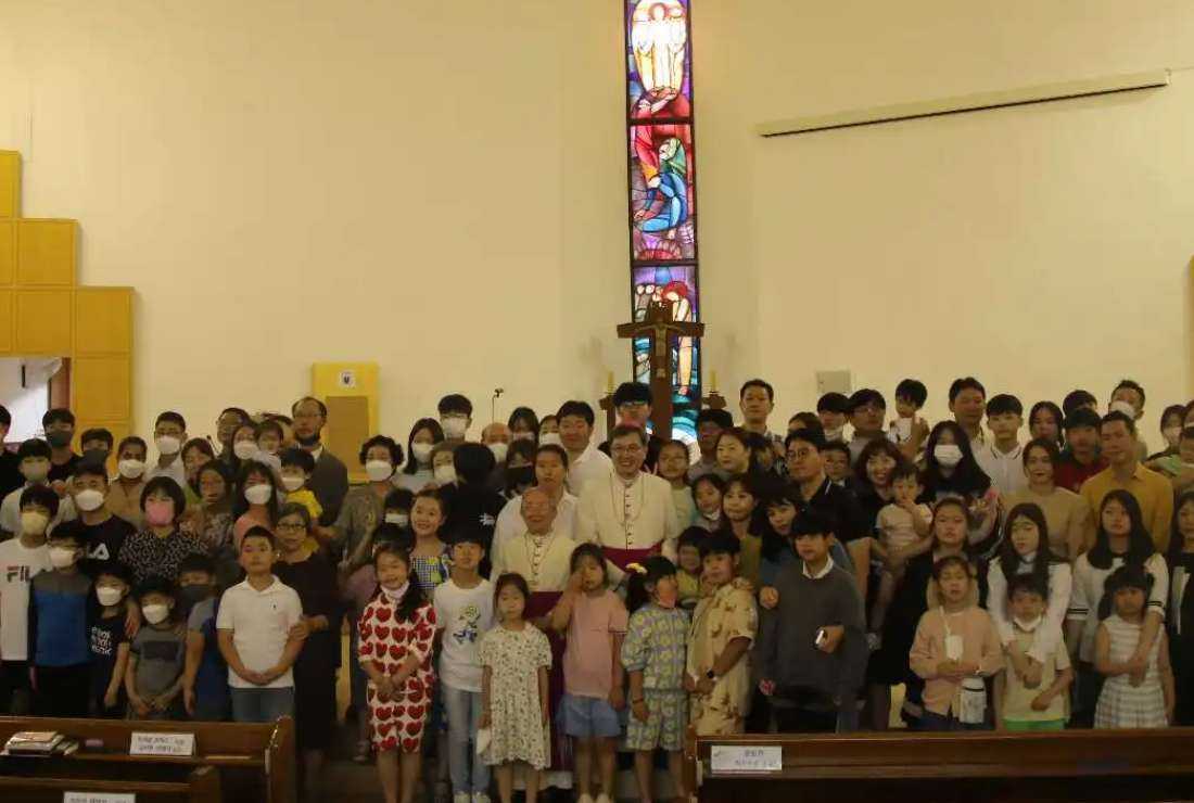 Archbishop Hyginus Kim Hee-joong of Gwangju with families and children after a Mass to mark the end of the Year of Amoris Laetitia Family on June 26
