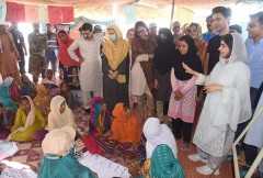 Malala visits women in Pakistan's flood camps