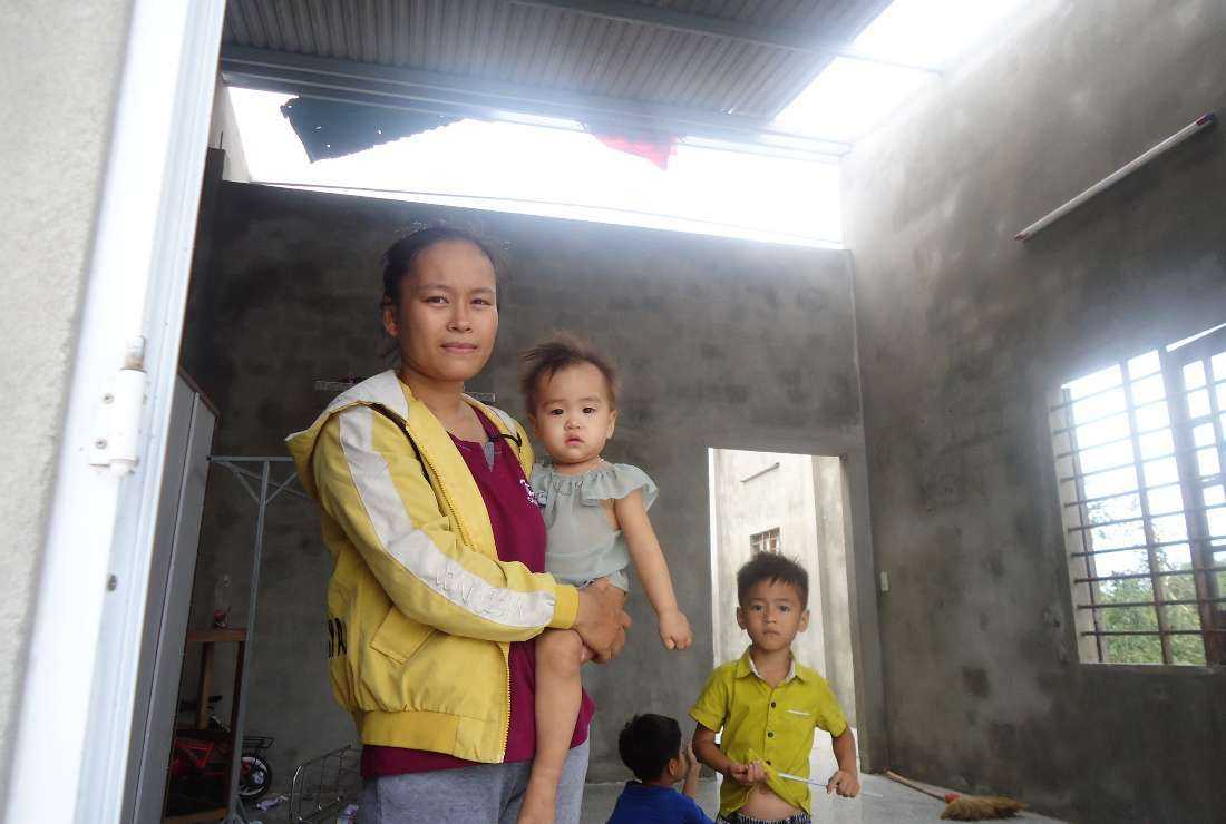 A flood victim family in seen after the devastating Typhoon Noru