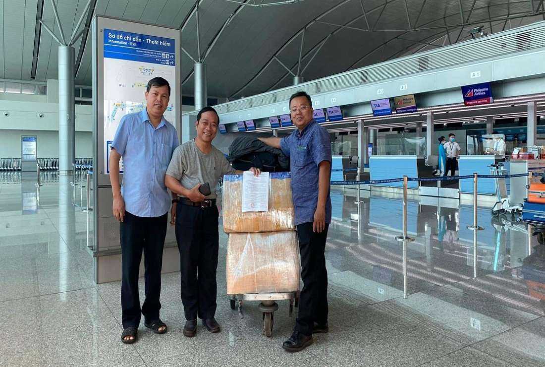 Father Joseph Truong Hoang Vu (right) and two other Redemptorists at Tan Son Nhat International Airport on Oct. 24
