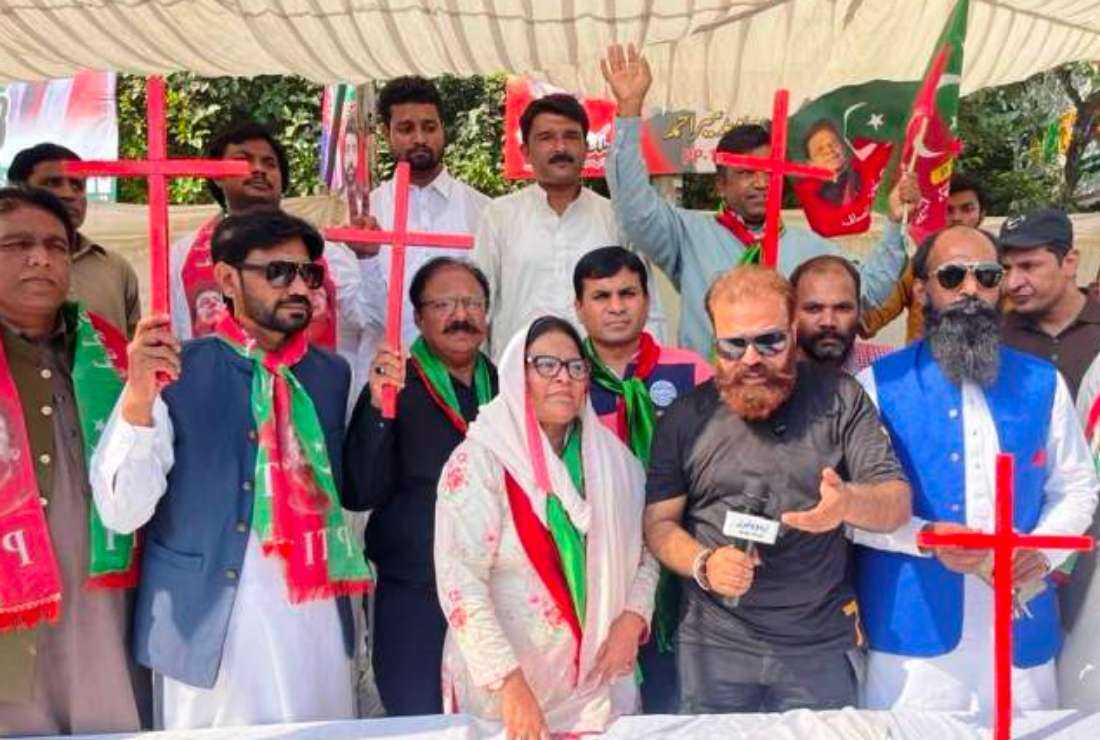 Shunila Ruth (center), a Christian woman leader of the Pakistan Tehreek-e-Insaf (PTI) party with her supporters holding red crosses at the Liberty Roundabout in Lahore on Oct. 28