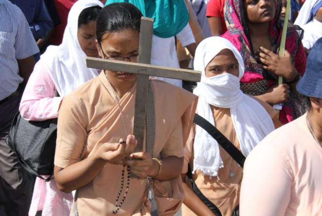 Catholics in the Delhi archdiocese pray during an annual Palm Sunday gathering on April 4, 2017