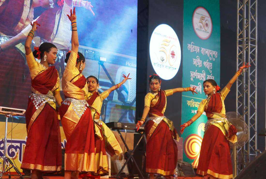 Young girls perform a traditional dance during the closing ceremony of Caritas Bangladesh's golden jubilee celebrations in the capital Dhaka on Nov. 12