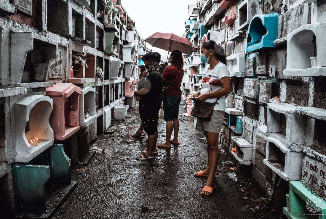 Relatives visit a columbarium in Venezuela city of the Philippines to pay respect to their loved lost ones