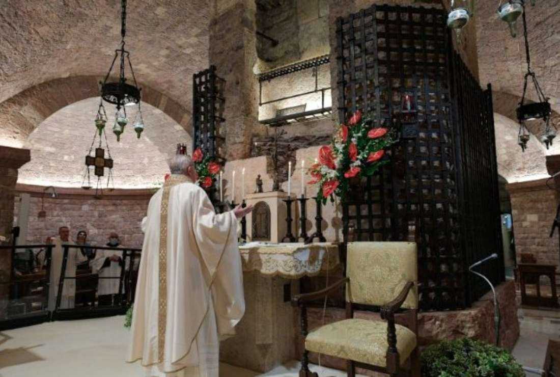 Pope Francis celebrates Mass at the tomb of St Francis in Assisi in 2020