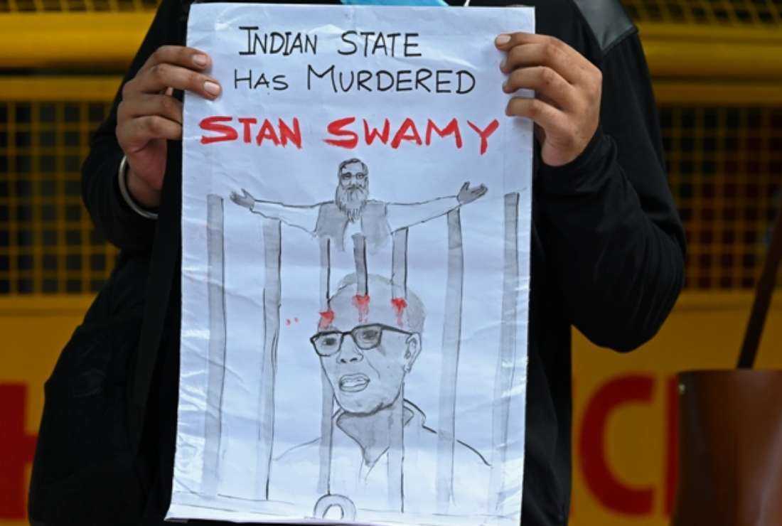 fr stan swamy passed away - A student takes part in a demonstration in New Delhi on July 6, 2021, after the Indian rights activist and Jesuit priest Father Stan Swamy, who was detained for nine months without trial under Indian anti-terrorism laws died on July 5 ahead of a bail hearing, officials said