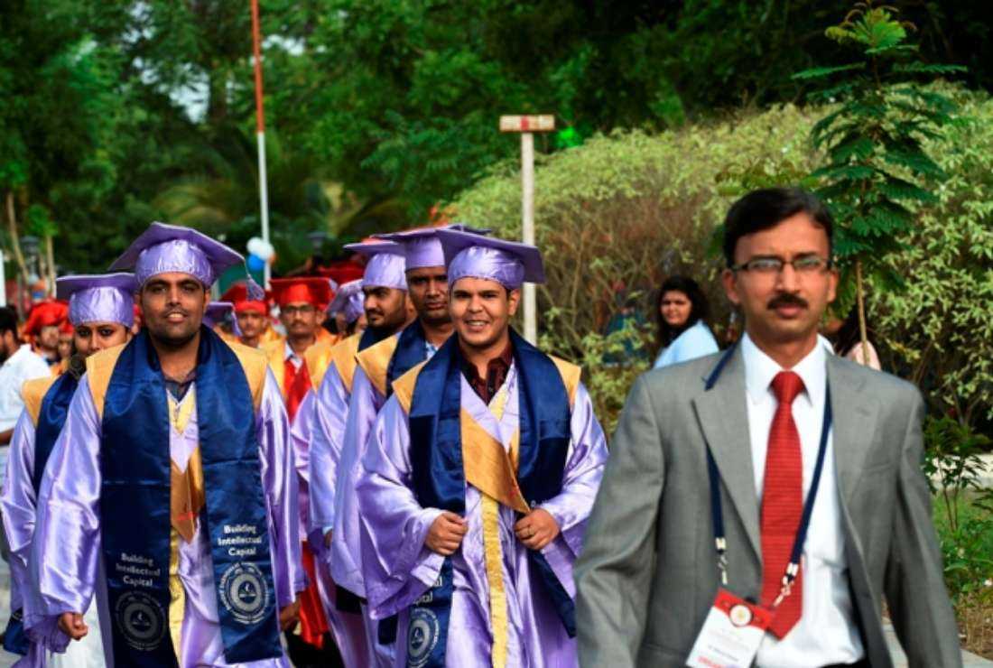 Indian students arrive for a convocation ceremony at their university campus in Gandhinagar, Gujarat, on August 29, 2019