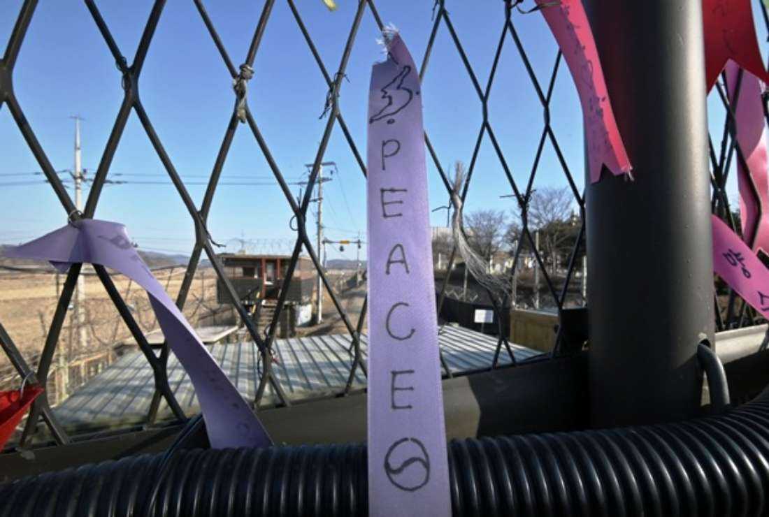 Ribbons wishing for peace and reunification of the Korean Peninsula hang on a military fence at the Imjingak peace park near the Demilitarized zone (DMZ) dividing the two Koreas in Paju on Jan. 1