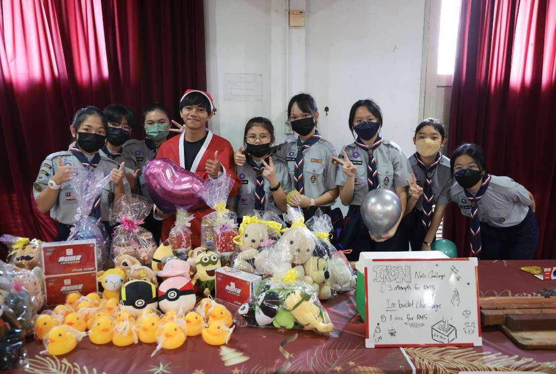 Children run a stall during Christmas Charity Bazar in Sarawak state of Malaysia to assist in raising funds for better care to animals on Dec. 4