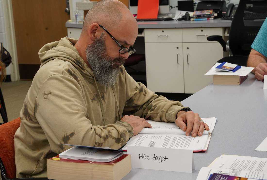 Mike Haught reads through OCIA materials during class at Immaculate Conception Parish in Ira Township on Nov. 28