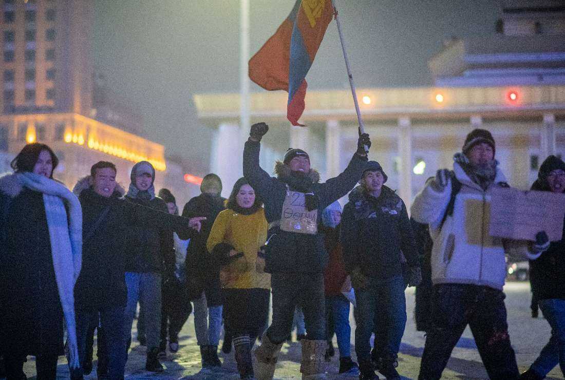 This photo taken on December 11, 2022 shows people gathering to protest against corruption in the coal industry and soaring inflation at Sukhbaatar Square in Ulaanbaatar, the capital of Mongolia