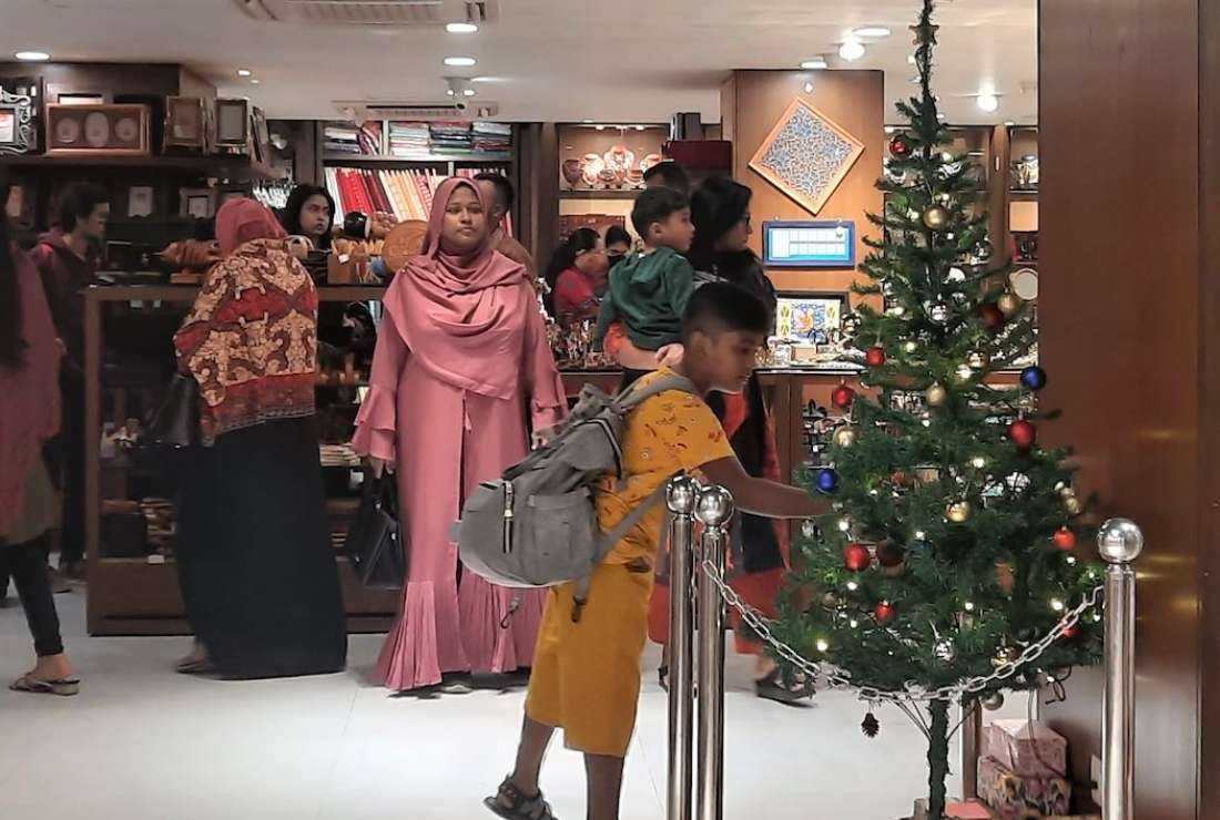 A textile shop in the Bangladeshi capital Dhaka is seen decorated with a Christmas tree ahead of Christmas. The once-unknown festival in the Mulsim majority country is fast becoming a season of brisk business