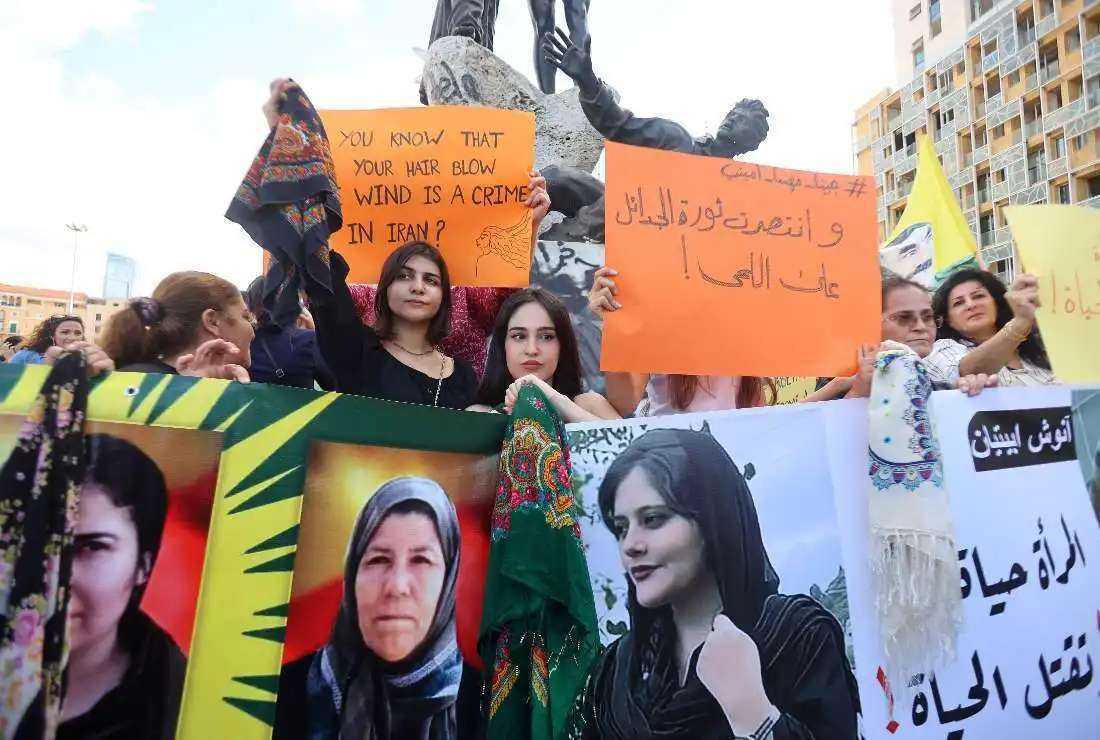 Kurdish and Lebanese women take part in a rally in the downtown district of Lebanon's capital Beirut on Sept. 21 days after the Iranian authorities announced the death of Mahsa Amini, who died after being arrested in Tehran for allegedly wearing a hijab headscarf in an 'improper' way