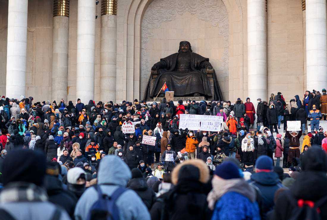 People gather to protest alleged corruption in coal industry and soaring inflation at Sukhbaatar Square in Ulaanbaatar, the capital of Mongolia on Dec. 5