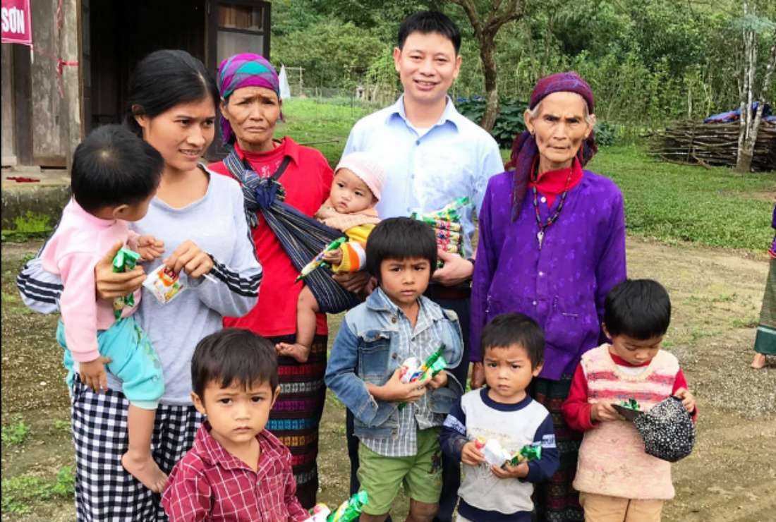 Father Thaddeus Tran Minh Danh offers sweets to Van Kieu villagers in Quang Tri province on Dec 14