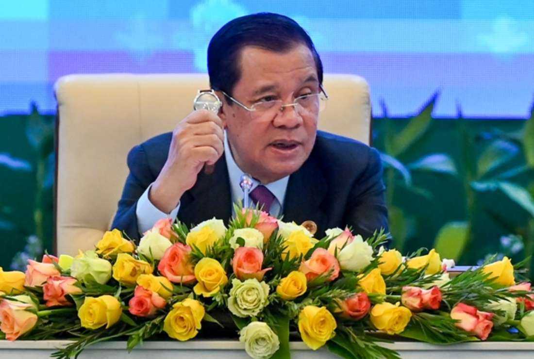 Cambodia’s Prime Minister Hun Sen shows a locally-made tourbillion watch, gifted to leaders attending the 40th and 41st Association of Southeast Asian Nations (ASEAN) Summits, during a press conference at the conclusion of the summit in Phnom Penh on Nov. 13