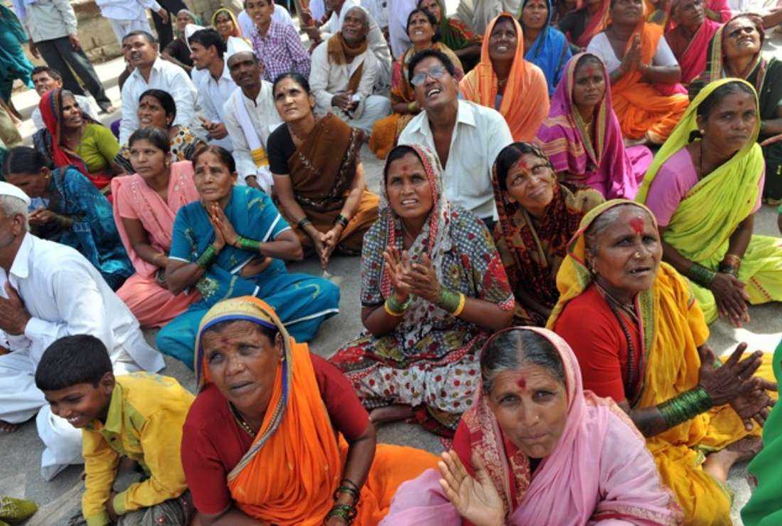 In this file photo Hindu pilgrims chant sacred verses as they await the start of an annual pilgrimage at the temple of Saint Dnyaneshwar at Alandi, near Pune in the western Indian state of Maharashtra, on June 23, 2011