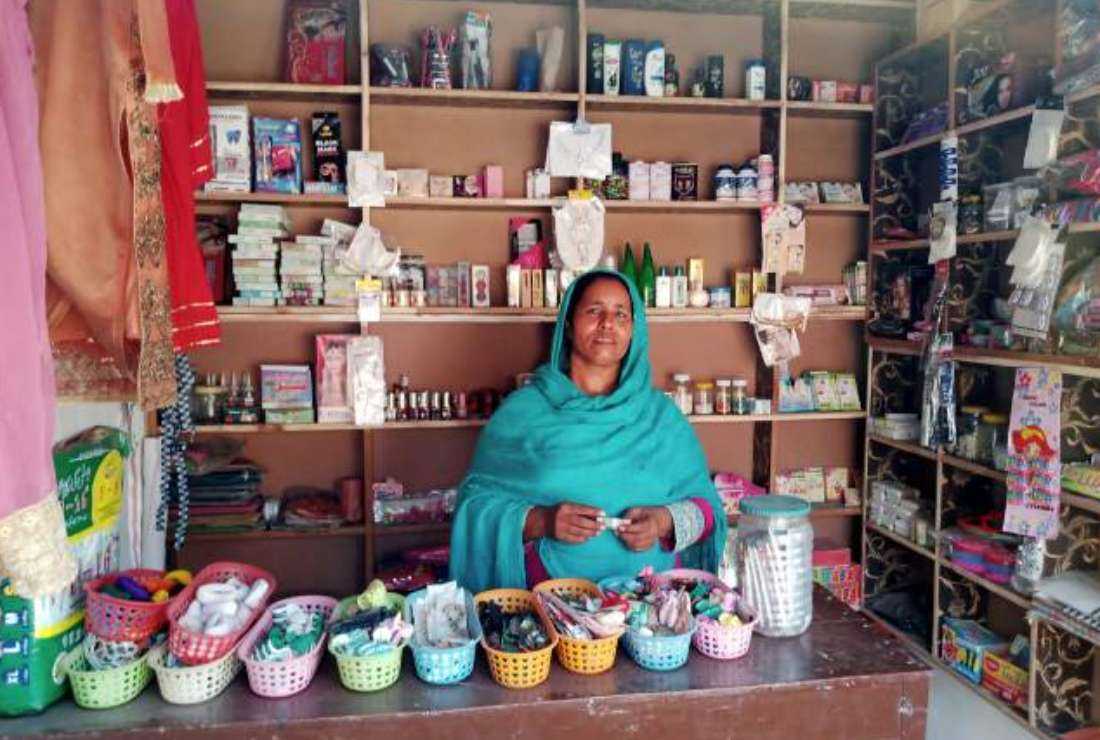 Mariam Bibi at the counter of her grocery store opened with an additional grant from the Association for Women’s Awareness and Rural Development (AWARD) based in Faisalabad in Punjab province, Pakistan.