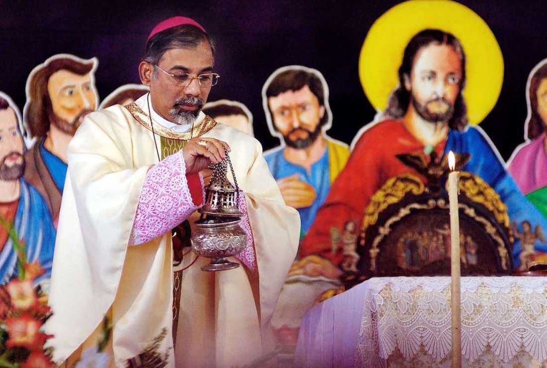 Cardinal Filipe Neri Ferrao, Archbishop of Goa, offers incense during a religious service held during the exposition of the body of St. Francis Xavier in Old Goa, on Nov. 21, 2004