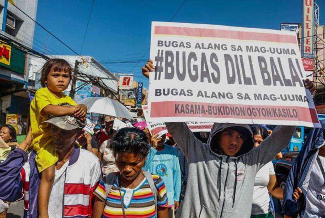 Farmers join a protest march in the Philippine capital Manila on Jan. 25 to deplore the rise in prices of food and fuel in the country