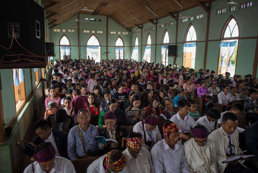 In this picture taken on May 13, 2018, internally displaced people and local villagers attend a church service in Myitkyina, Kachin state